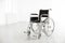 Modern wheelchair in empty room. Medical equipment
