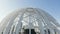 Modern white dome-shaped structure. Stock footage. Top view of beautiful domed structure in modern city. Beautiful domed