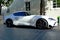 Modern white electric sports car in urban setting, Japanese made popular brand