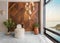 Modern white feather armless chair, two plant pots, wood cladding wall, and side window revealing calm sea at sunset