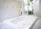 Modern white house bathroom bathtub with courtyard skylight