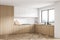 Modern white kitchen corner with wood materials and window over a sink