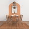 Modern white, orange and wooden dining room with table set and vintage scandinavian chair, empty space with carpet, door, mirror