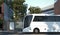 Modern white realistic coach bus at cityscape background near bus stop. 3d rendering.