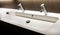 Modern white sink with two shining faucets, tap