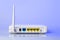 Modern wi-fi home router with antenna on light blue background