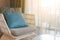 Modern wicker chair with cushion and comfort pillow in room. Near by the window