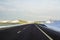 Modern wide smooth empty asphalt highway stretching to horizon u