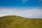 Modern windmills on a green hill