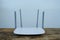 modern wireless Wi-Fi Router with four non-removable external antennas for better search and signal transmission on wooden table,