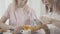 Modern women gossip in a restaurant, pour tea and eat biscuits.