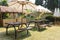 Modern wooden bench and umbrella in Thailand park