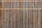 Modern wooden brown lath decoration on facade