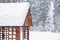 Modern wooden gazebo on snowy day. Winter vacation