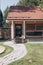 Modern wooden house with a tiled roof. Solid log cottage for a comfortable stay and living outside the city. Vertical shot