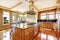 Modern wooden kitchen room design with hardwood floor, island, g