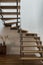 Modern wooden stairs with silver railing