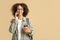 Modern worker or student with technology. Portrait of african american woman in glasses talking on phone