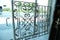 Modern wrought-iron grid in old style. Elegant wrought iron door