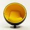 Modern yellow ball chair isolated on white