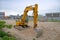 Modern Yellow Excavator at Construction Site. Horizontal image of bulldozer