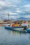 Modern Zodiac boat for big group of tourists is leaving the harbor of Husavik for whale watching safari, Iceland