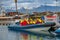 Modern Zodiac boat for big group of tourists is leaving the harbor of Husavik for whale watching safari, Iceland