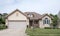 Modest Midwestern House with Tan Stone and Stucco