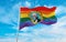 modified flag of Washington state, USA with rainbow LGBT pride flag at cloudy sky background on sunset, panoramic view. copy space