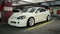 Modified white Honda Integra Type R DC5 sport car parked in an underground parking lot