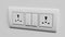 Modular switchboard electrical outlet, interchangeable on a white wall. 3d render