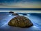 Moeraki Boulders under a dramatic dawn sky New Zealand