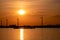 Moerdijk Netherlands, sunset winth windmills by the lake Vokerak river in Holland windmill energy sunset