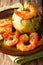 Mofongo Garlic-Flavored Mashed Plantains: a very tasty dish served with shrimp close-up on a plate. Vertical