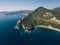 Mogren Beach, near the old town of Budva, in Montenegro. The ancient Mogren Fort on the mountain. Rocky cliffs on the