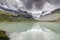 Moiry Glacier and lake reflection with clouds