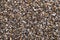 Moist loose chippings, crushed stone, road and plaster grit, surface, from above