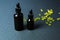 Moisturizing and healing skin serum with vitamin C on a black background. Vitamin capsules as a supplement to a cream or essence