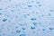 Moisturizing liquid blue drops on pastel background. Cosmetic toner or Water Drops. Hyaluronic serum Bubbles close-up