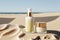 Moisturizing oils and lotions for tanning on a beach against the sea