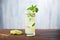 mojito cocktail with muddled mint leaves and lime