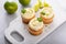 Mojito cupcakes with lime and coconut garnished with mint