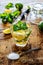 Mojito drink ingredients on vintage wooden table. Mint, sugar and lime slices for cuban shoot cocktail making from above