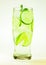 Mojito lime and mint with ice and soda with drops on a glass