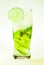 Mojito lime and mint with ice and soda with drops on a glass