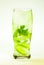 Mojito lime and mint with ice and soda with drops on a glass