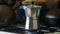 Moka pot brewing on a gas stove. Taditional way of brewing Italian coffee.