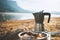 Moka pot coffee outdoor in lake, campsite morning picnic lifestyle, cooking hot drink in nature camping, cooker prepare breakfast
