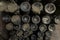 Mold, cobweb and dust on vintage wine bottles in an underground cellar