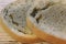 Mold growing rapidly on moldy bread on wooden background. Mildew on a slice of bread. Stale bread, covered with mildew.